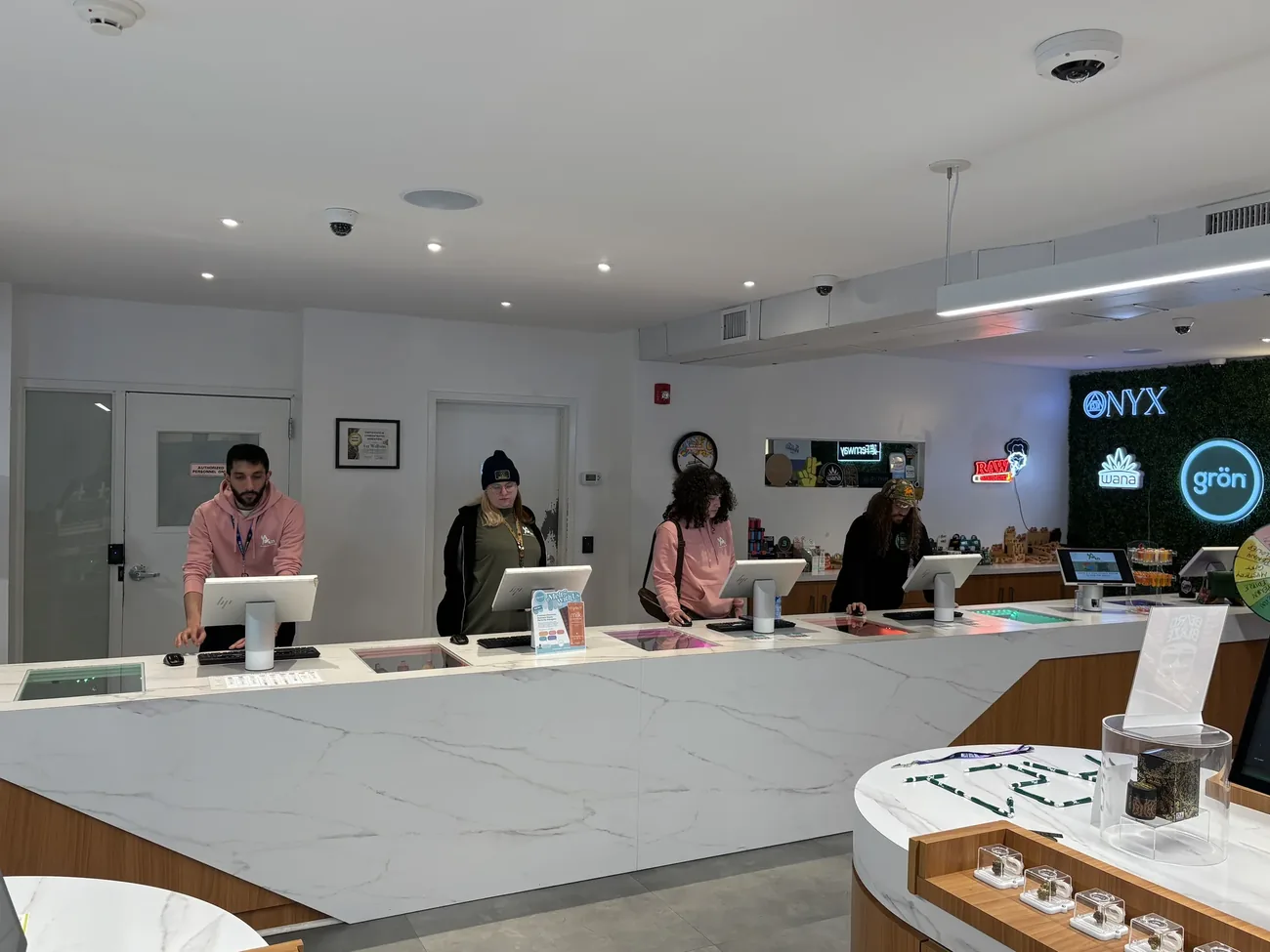 The A21 Wellness Dispensary team at the counter